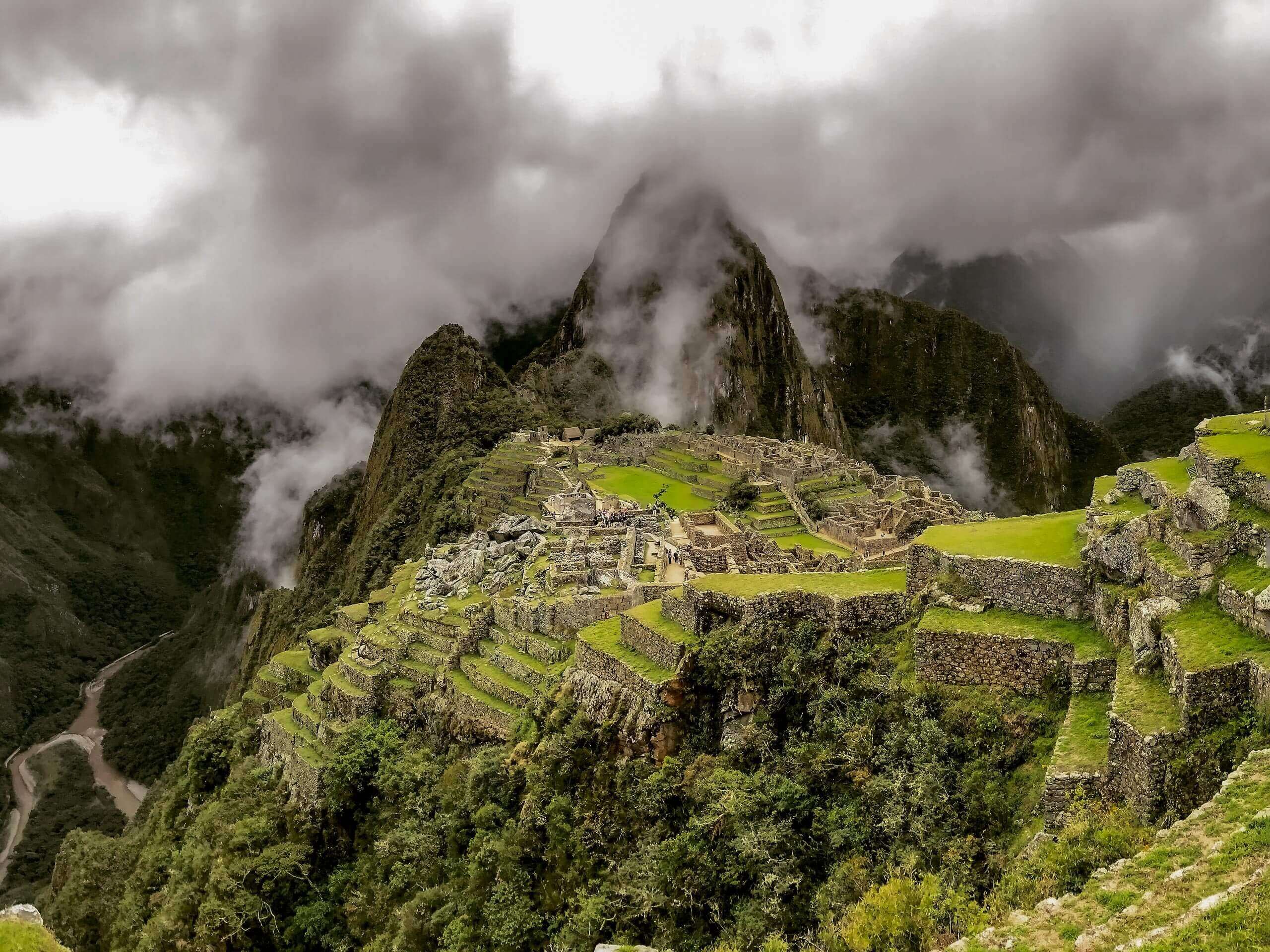 Machu Picchu ancient village through the fog