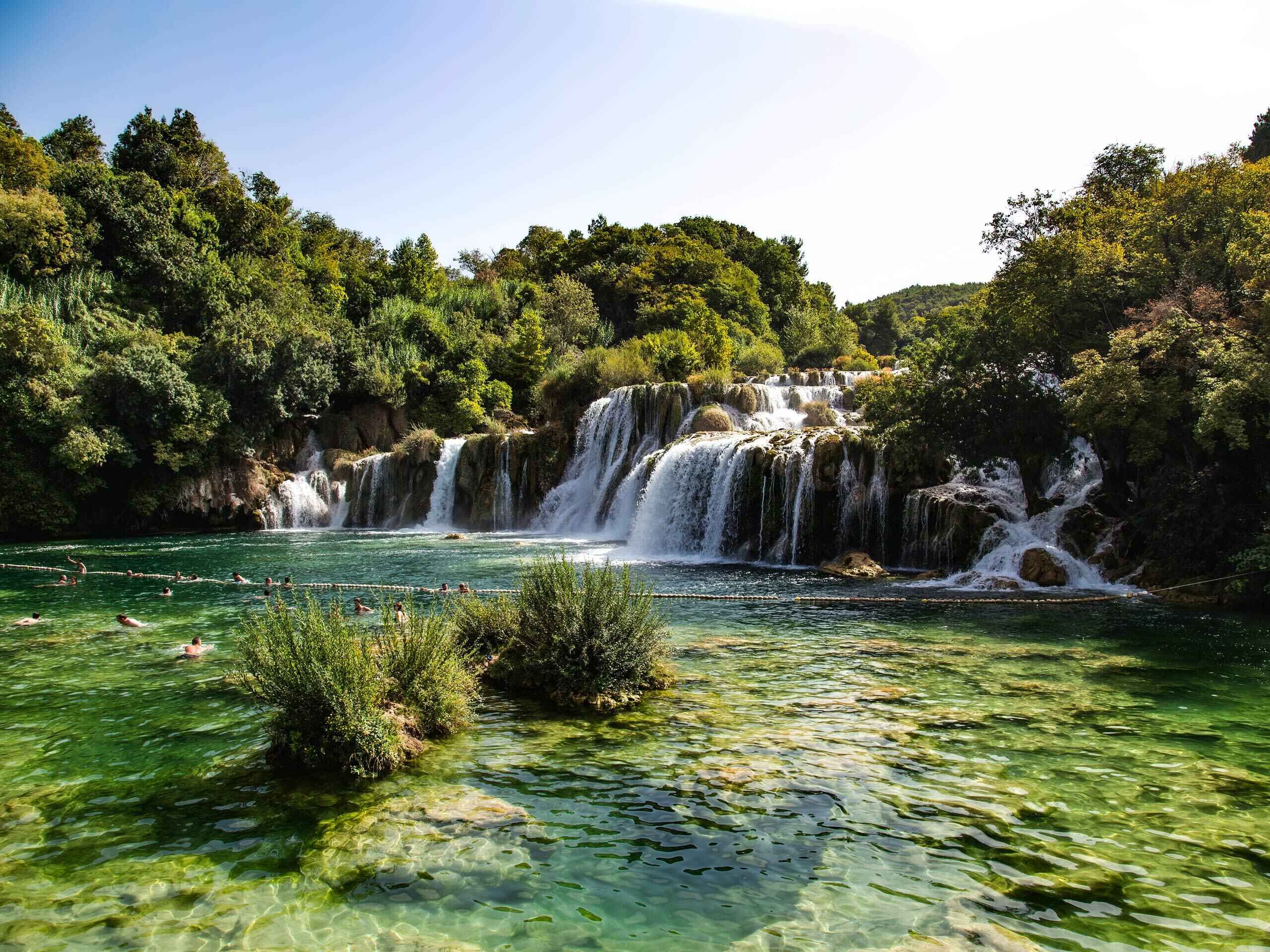 Swimming under waterfalls in Plitvice National Park