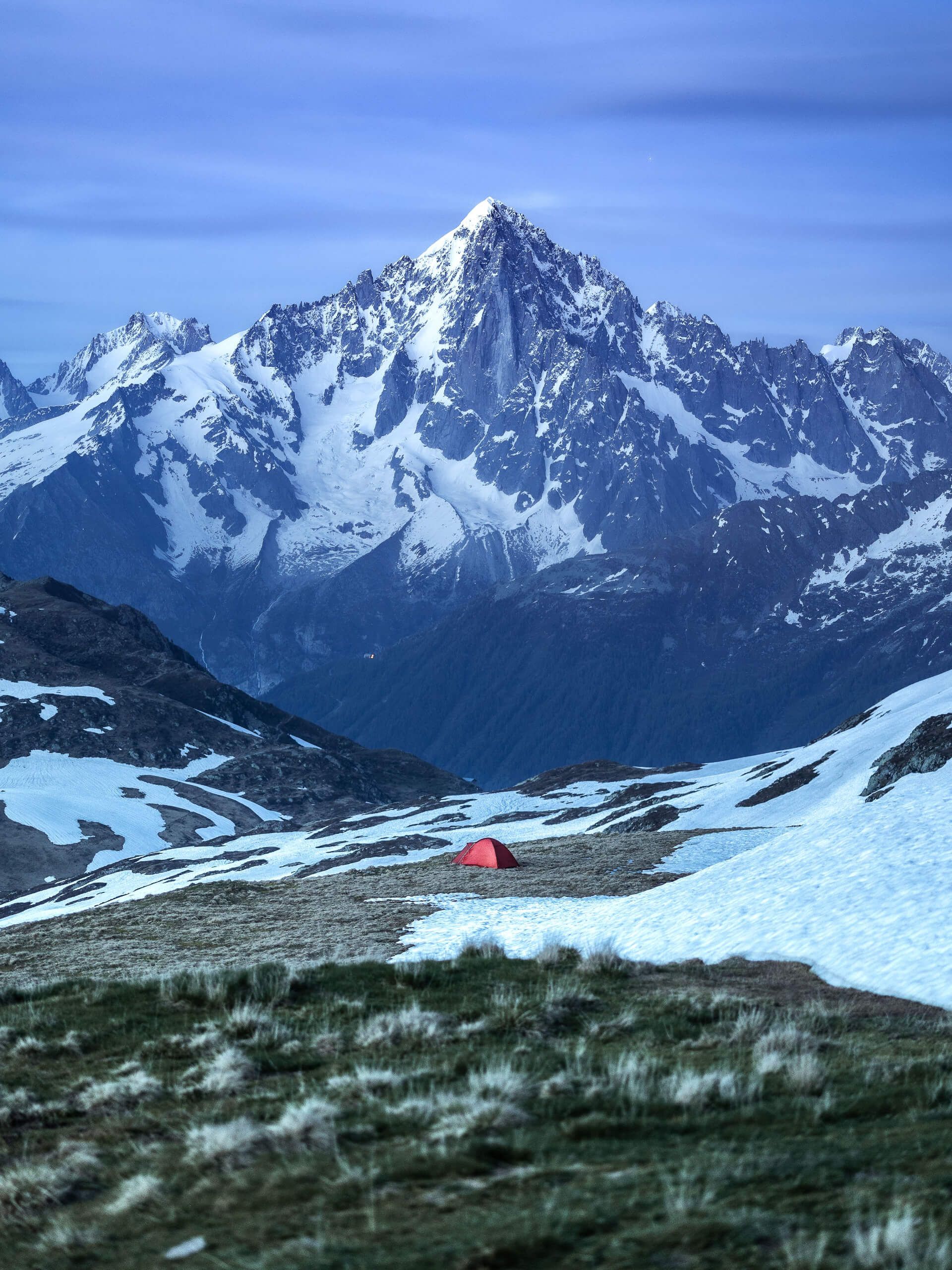 Alpine camping tent snowy mountains
