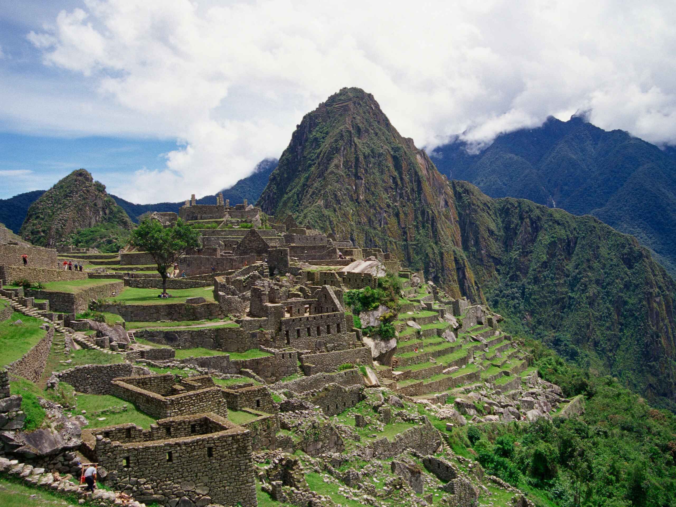 Machu Picchu ancient Inca ruins surrounded by the Andes mountains in Peru